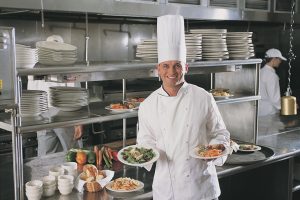 care home chef preparing meals in nursing home kitchen UK